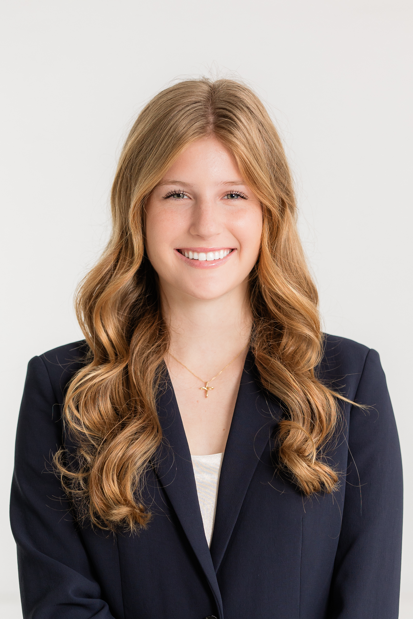 close up professional headshot of a woman in a dark blazer against a white background branding photos in atlanta GA